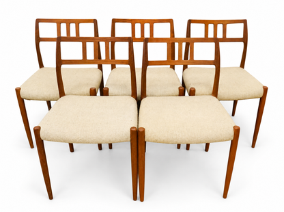 Set of five teak dining chairs with pale upholstered seats, cataloged as Niels Otto Møller