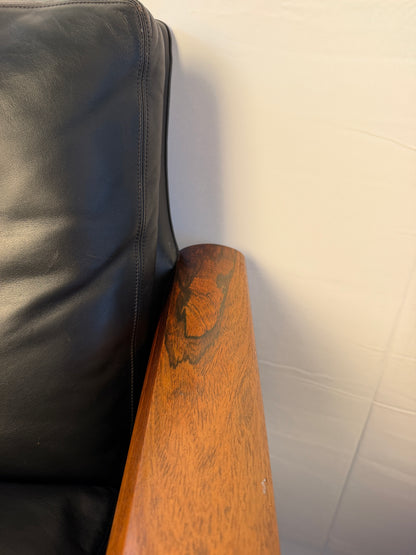 Original detail of surface wear on a rosewood lounge chair arm