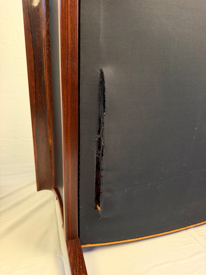 Original underside view showing a tear in a lounge chair’s bottom covering