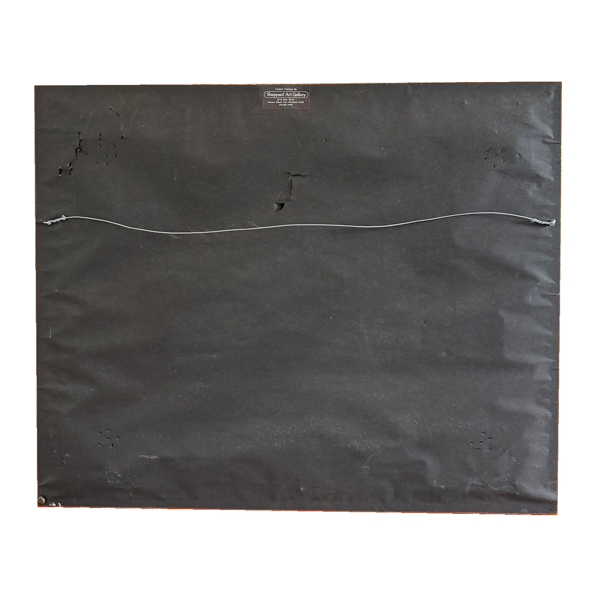 Reverse of the Fritzner Louis painting showing backing paper and hanging wire, on white background