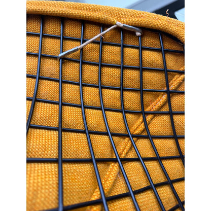 Mustard-upholstered Diamond lounge chair, wire frame, base attachment and upholstery edging detail