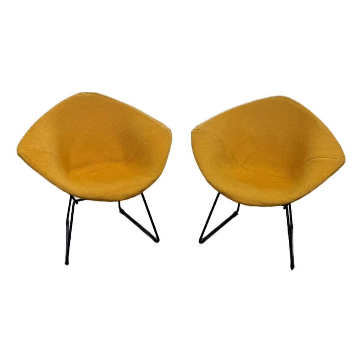 Mustard-upholstered Diamond lounge chair, pair shown from the front on white background