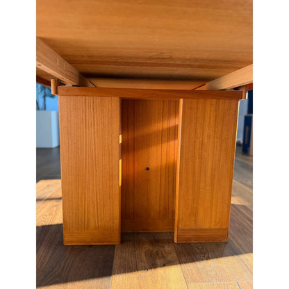 Teak expanding dining table, underside and panel-style base