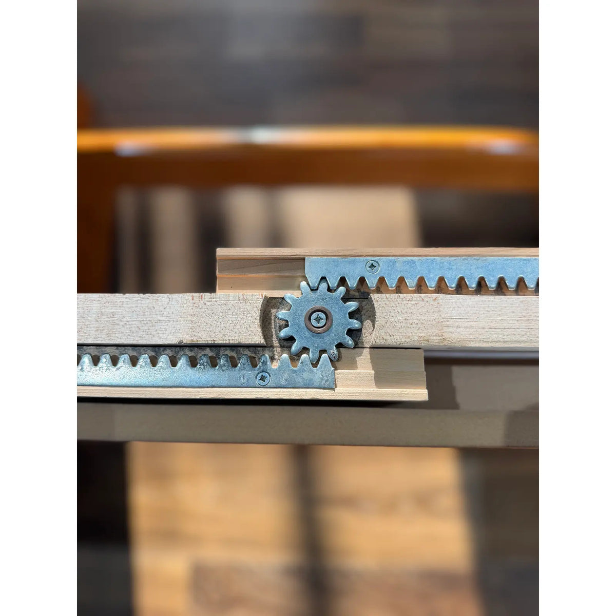 Teak expanding dining table, rack-and-pinion expansion mechanism