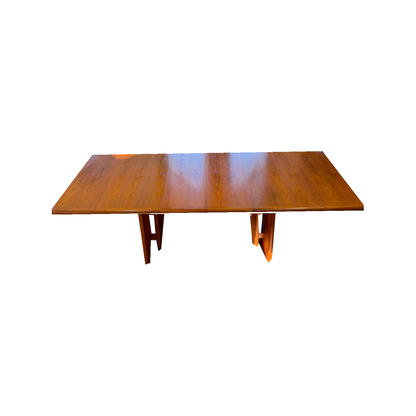 Teak expanding dining table, top and base viewed from above the long side, on white background