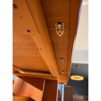 Teak expanding dining table, underside with closing latch and rails