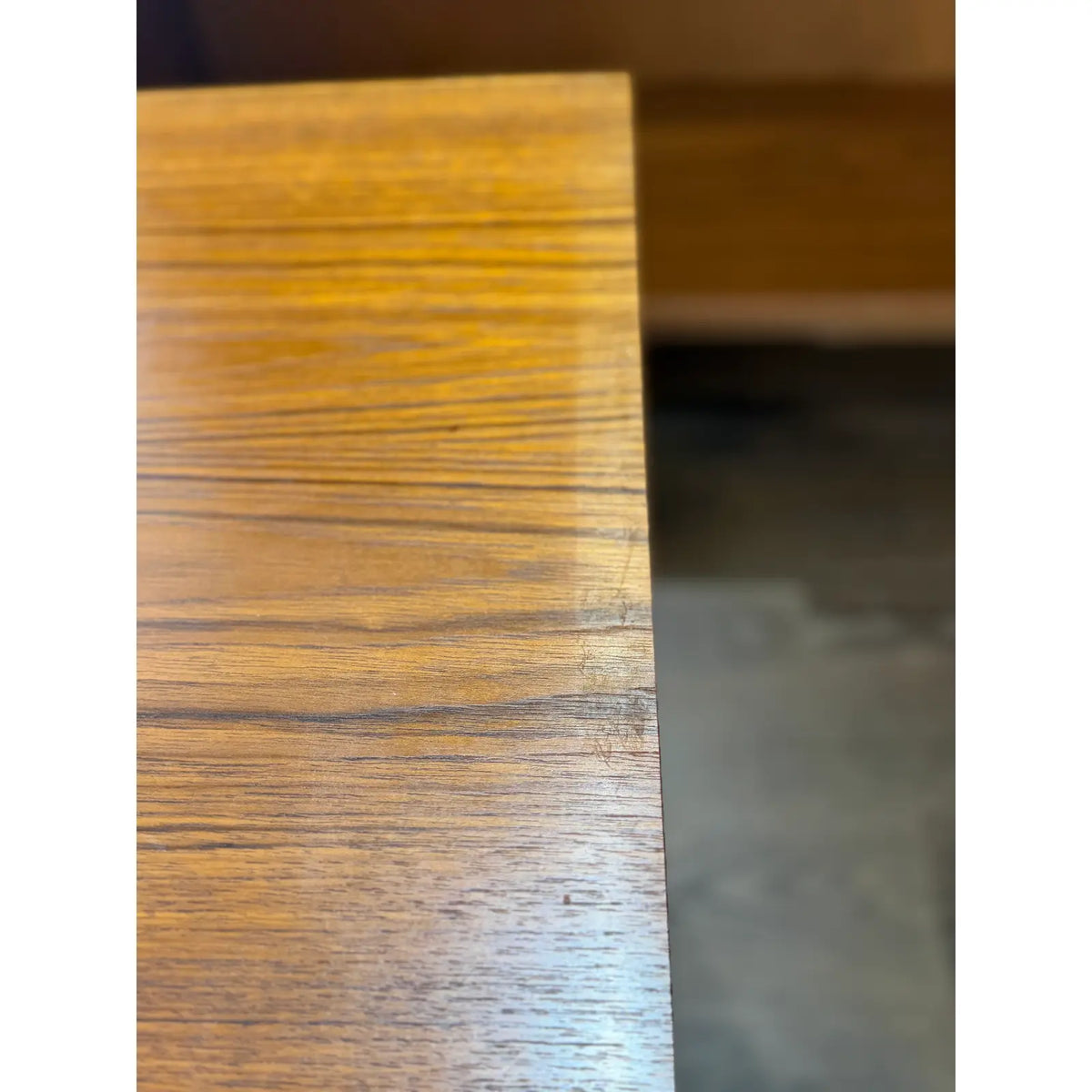 Hundevad teak wall unit with secretary, close view of a teak edge and finish wear